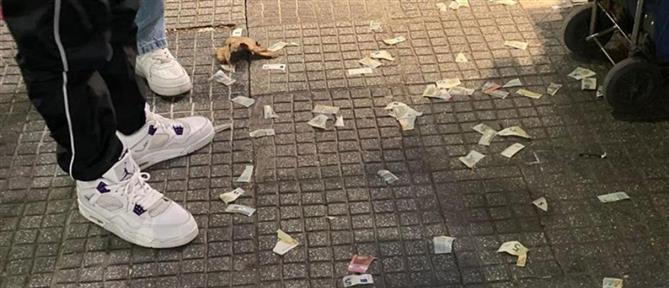 Θεσσαλονίκη: Έσκιζε χαρτονομίσματα και τα πετούσε στο κέντρο της πόλης! (εικόνες)